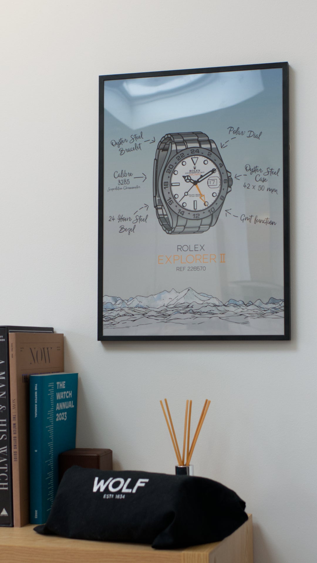 Rolex Explorer II Art Print displayed in a thin black frame, hung on a wall next to some books about watches.

An icon within the Rolex catalog and history, this latest reference, the 226570, is the perfect tool watch to wear when amongst vast mountain ranges. 

These prints make the perfect gift idea for the watch collector in your life.
Printed on premium Giclée 308 (GSM) paper, your print will be gallery quality.
All prints are made to order and come with a certificate of authenticity.